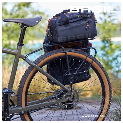 Bolsa Basil Miles Tarpaulin 7L con reflectante cierre velcro negro/naranja