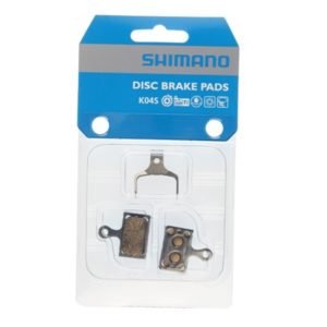 Juego de pastillas de freno Shimano K04S metalicas para M9100/M8100/R9150/R8150/R7000/GRX plata